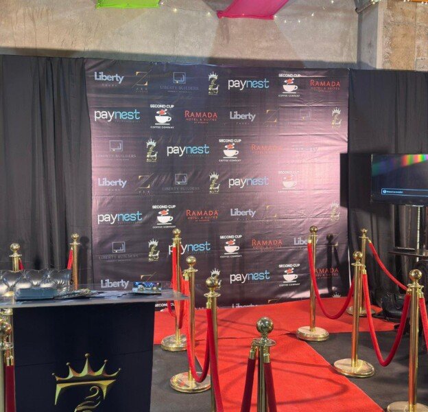 ZNJ reception desk and red-carpet setup at the Basant event
